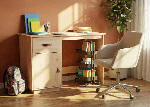 A wooden desk, beige upholstered office chair, storage cart, a colorful patterned backpack, and school supplies in a styled study room.