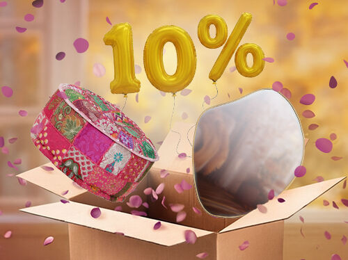 Open box with colourful pouffe and mirror popping out, purple petals scattered around in an indoor setting. Yellow balloons show a 10% discount. Click to see the products in the offer.