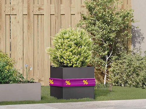 Raised garden bed filled with green plants, wrapped in purple band with yellow discount icons. Click to see the products in the offer.