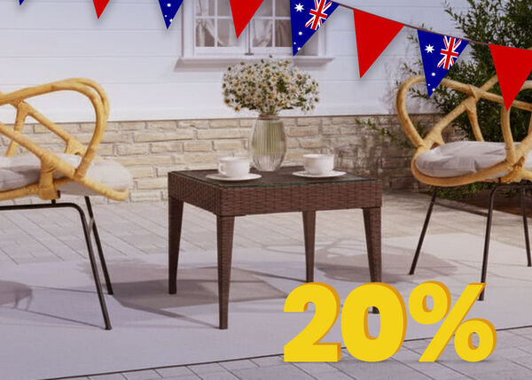 Outdoor patio set with two chairs and a table, decorated with Australian flag bunting and a yellow sale tag with a percentage sign on the table.