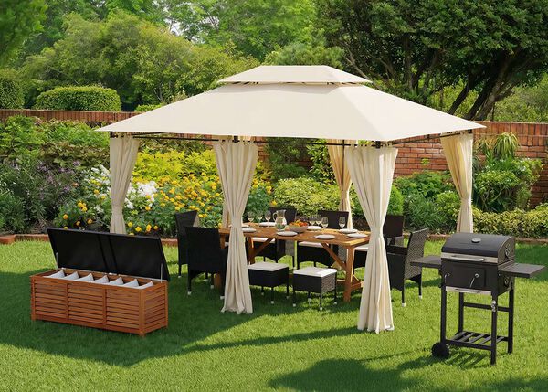Garden gazebo with curtains covering an outdoor dining table and chairs on a lawn, next to a barbecue grill and storage bench.