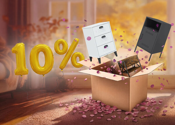 Open box with white, black, and wooden bedside cabinets popping out, purple petals scattered around in an indoor setting. Yellow balloons show a 10% discount. 