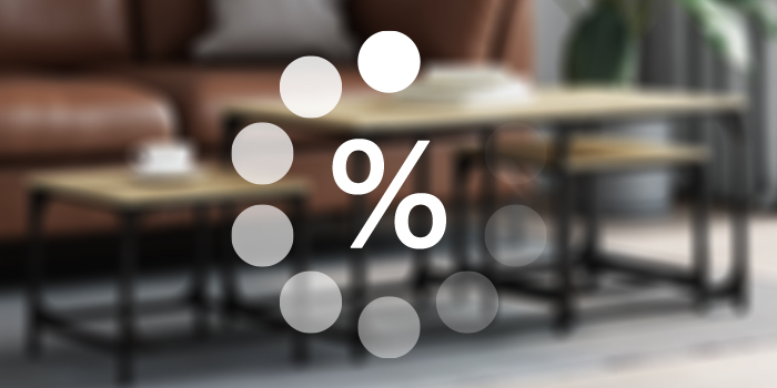 Discount promotion featuring a white circle graphic with a percentage symbol overlaid on a blurred background of a living room with a leather sofa and wooden coffee table.