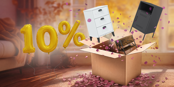 Open box with white, black, and wooden bedside cabinets popping out, purple petals scattered around in an indoor setting. Yellow balloons show a 10% discount. Click to shop the collection.